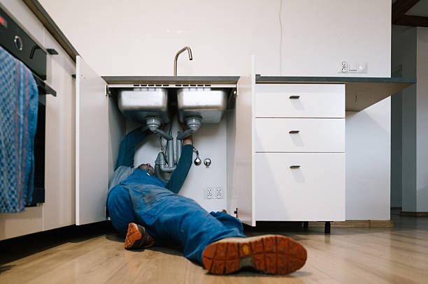 Professional Emergency Plumber technician working in Dale, IN